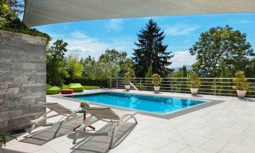 Beautiful,House,,Swimming,Pool,View,From,The,Veranda,,Summer,Day